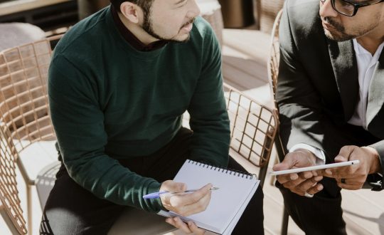 Business partners using  a tablet for discussion