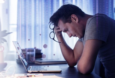 Man feeling sick while working from home during the coronavirus pandemic