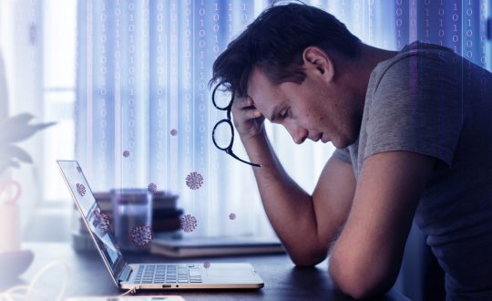 Man feeling sick while working from home during the coronavirus pandemic