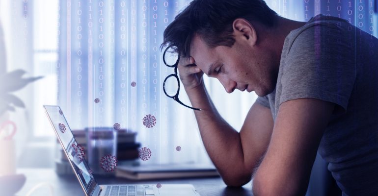 Man feeling sick while working from home during the coronavirus pandemic