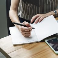 Woman writing in a notebook